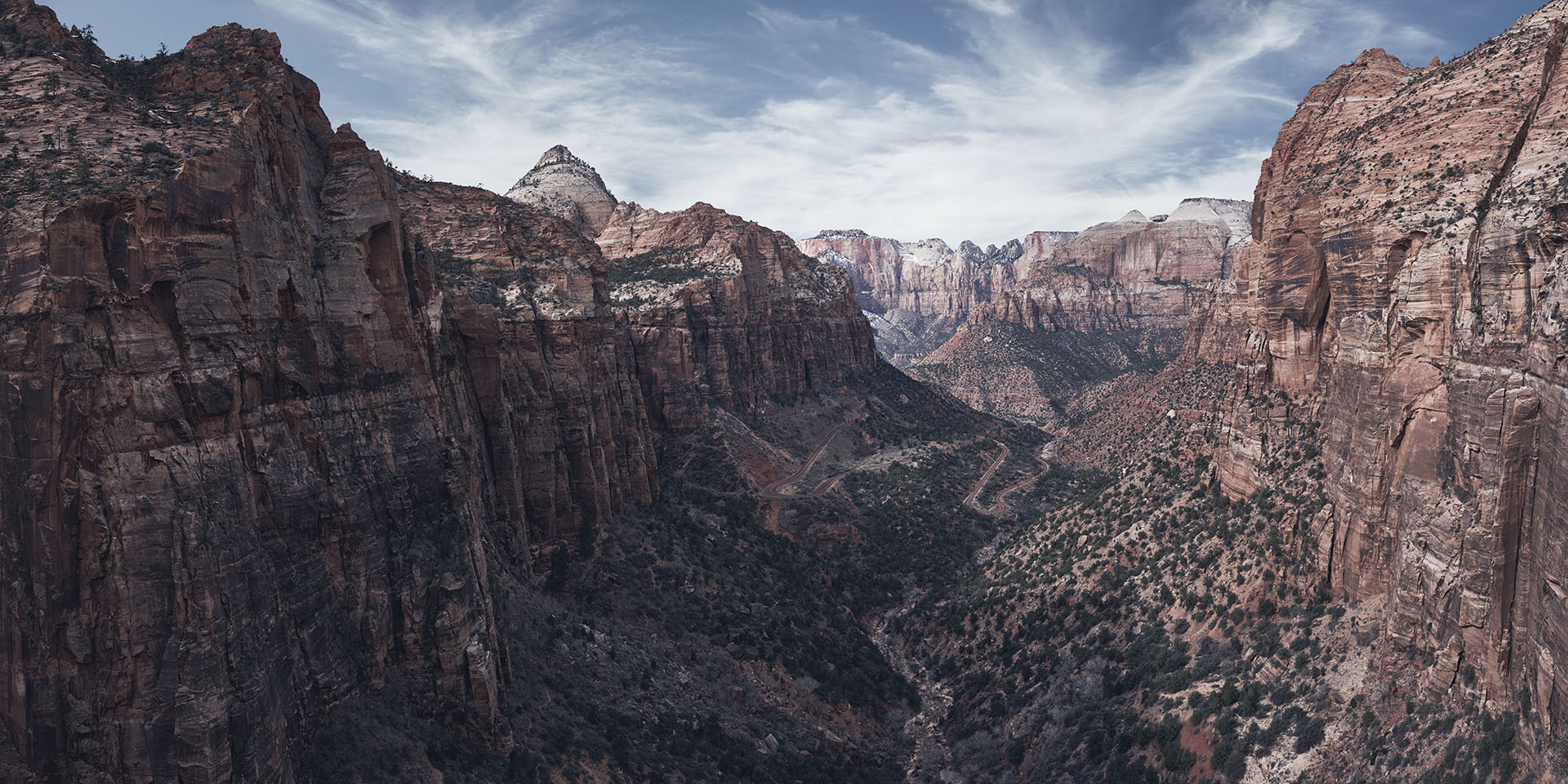 Breathtaking high stony mountains under cloudy sky